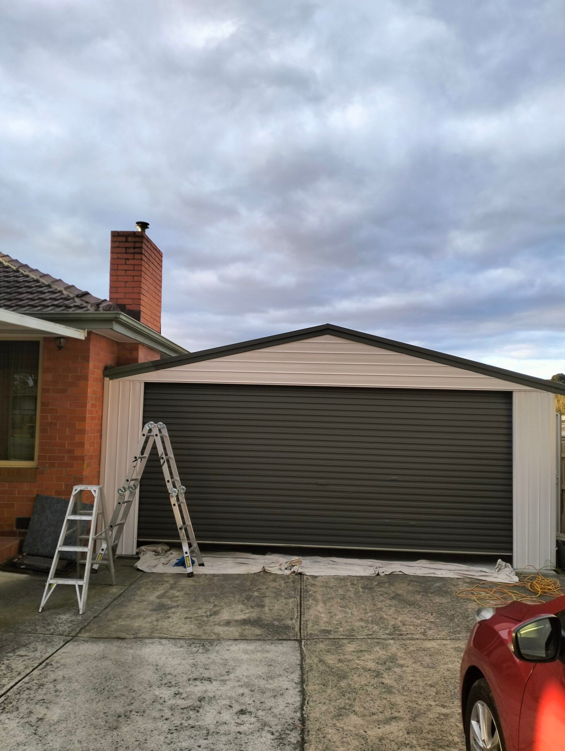 Professional garage roller door and gable spray painting service in Bayswater and surrounding South-east Melbourne suburbs by S and R Painting Group.