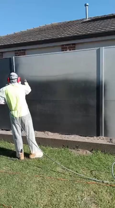 Professional exterior house fence spray-painting service